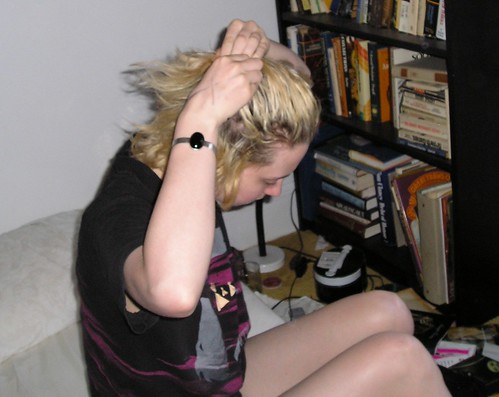 Sarah fixing her hair just after rolling out of bed