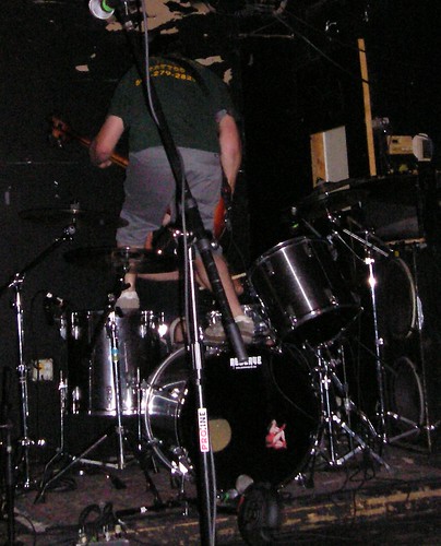 Reserve's bassist climbs on the drumkit